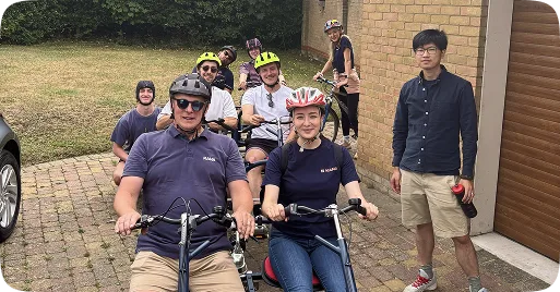 Kana Earth team cycling together outdoors